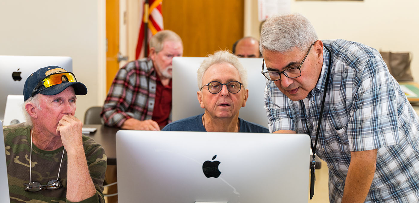 Folks working on a computer